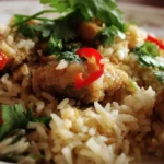 Delicious homemade Rice and Chicken plated with herbs and spices
