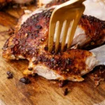 Deliciously roasted spatchcock chicken served with herbs and spices.