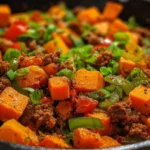 Sweet Potato Ground Beef Skillet with colorful vegetables in a pan