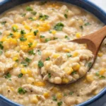 Bowl of creamy white chicken chili topped with cilantro and jalapenos