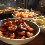 Festive 4th of July party food spread with red, white, and blue decorations.