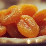 A variety of dishes featuring apricot recipes including desserts and salads.