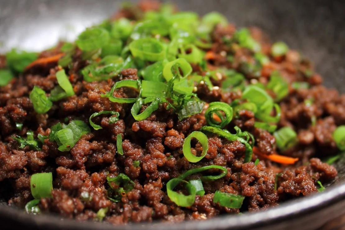 Bowl of Asian Ground Beef stir-fry with colorful vegetables