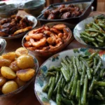 A variety of colorful BBQ side dishes including coleslaw, corn salad, and baked beans.