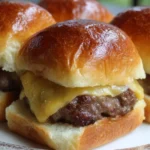 Beef sliders served on Hawaiian rolls with toppings