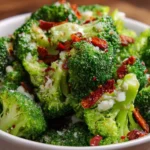 A vibrant broccoli salad with fresh vegetables and dressing