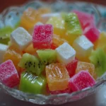 Colorful Candy Salad with various sweets and fruits, perfect for a festive dessert.