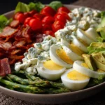 Delicious Cobb Salad featuring avocados, bacon, and fresh vegetables.