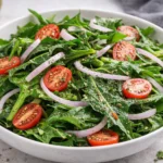 A fresh dandelion salad with vibrant greens and colorful toppings.