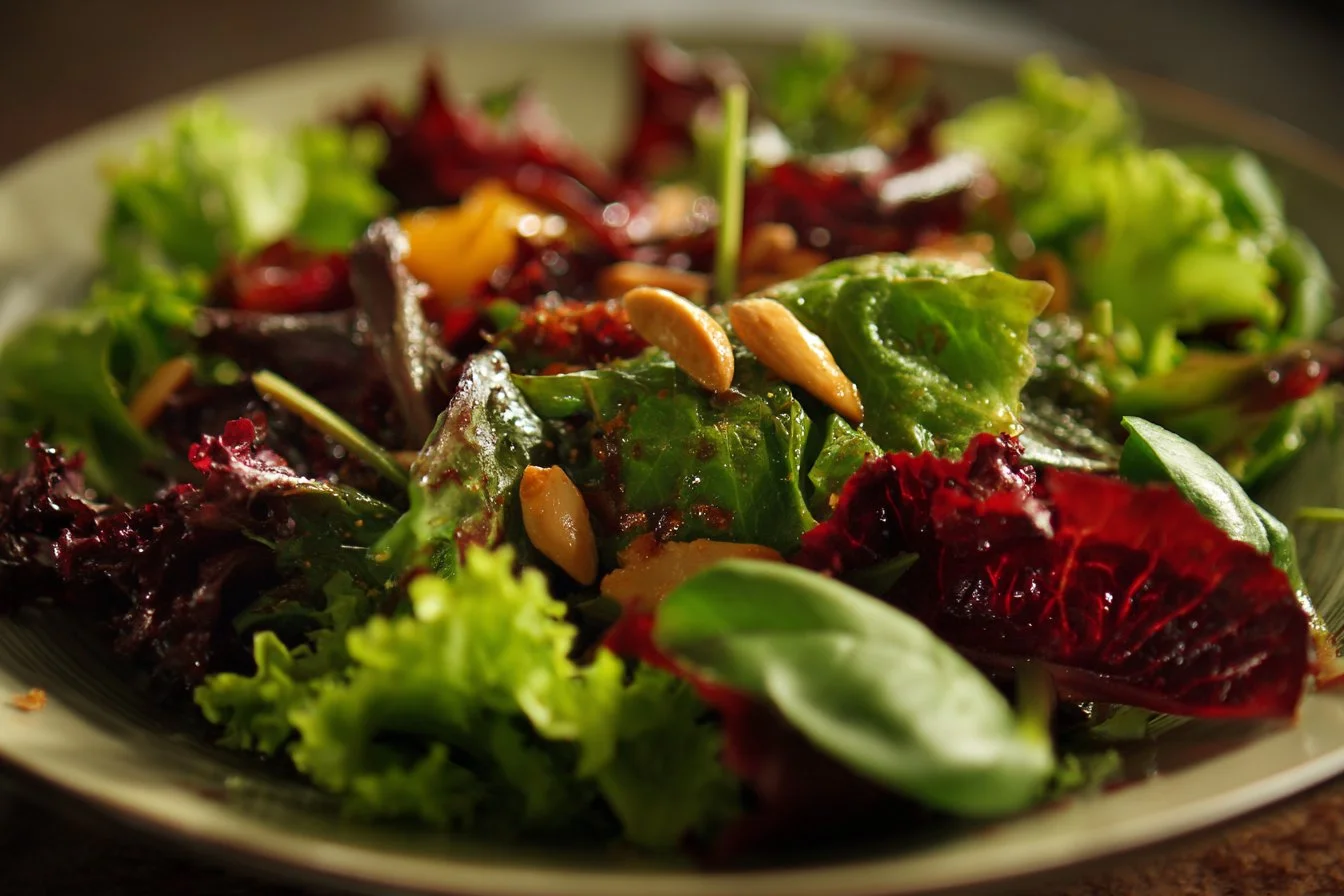 A vibrant fall salad with seasonal vegetables and nuts, served in a bowl.