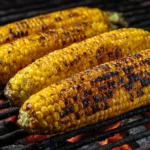 Delicious grilled corn on the cob served on a plate