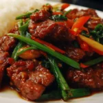 Healthy beef dinner on a plate with vegetables and seasonings