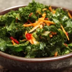 Fresh kale salad with colorful vegetables and a light vinaigrette dressing.