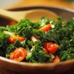 Fresh kale salad with colorful vegetables and dressing in a bowl