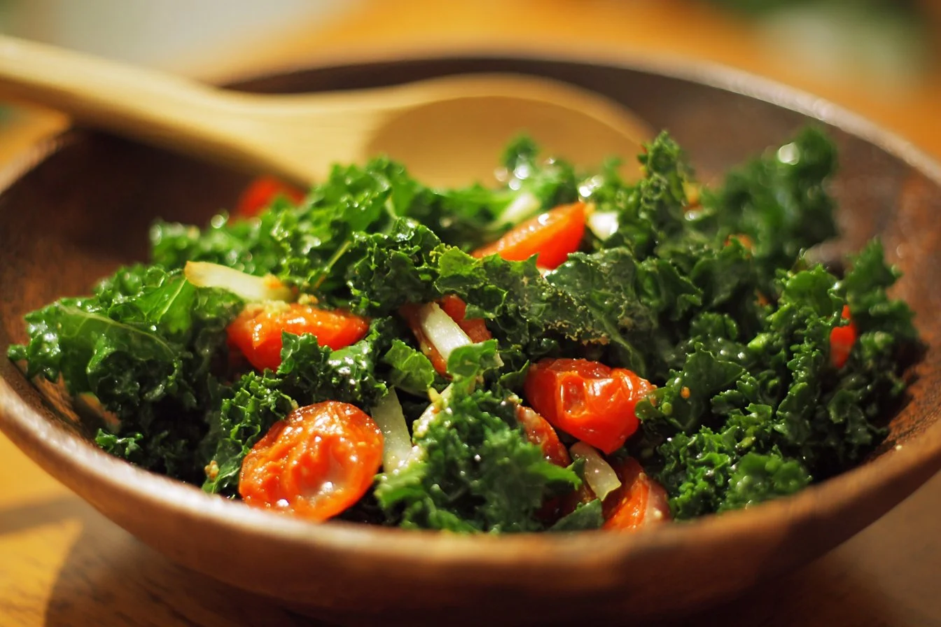 Fresh kale salad with colorful vegetables and dressing in a bowl