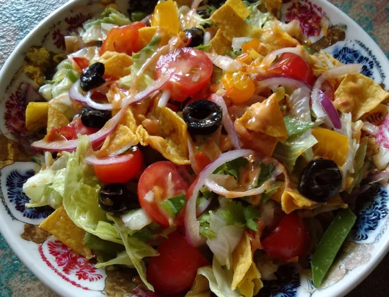 Colorful Mexican Salad with fresh vegetables and dressing
