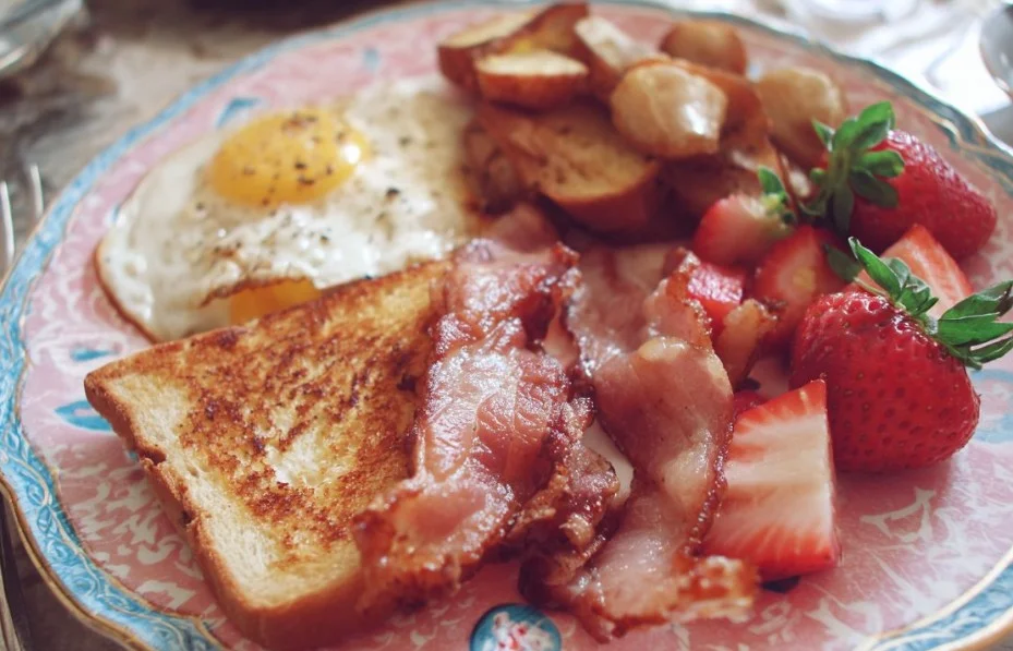Delicious Mother's Day brunch spread with flowers and treats