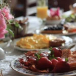 Mouthwatering Mother's Day brunch spread with flowers and elegant table setting.