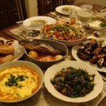 Elegant Mother's Day dinner table setting with flowers and candles.