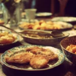 Mother's Day dinner table set with flowers and delicious food