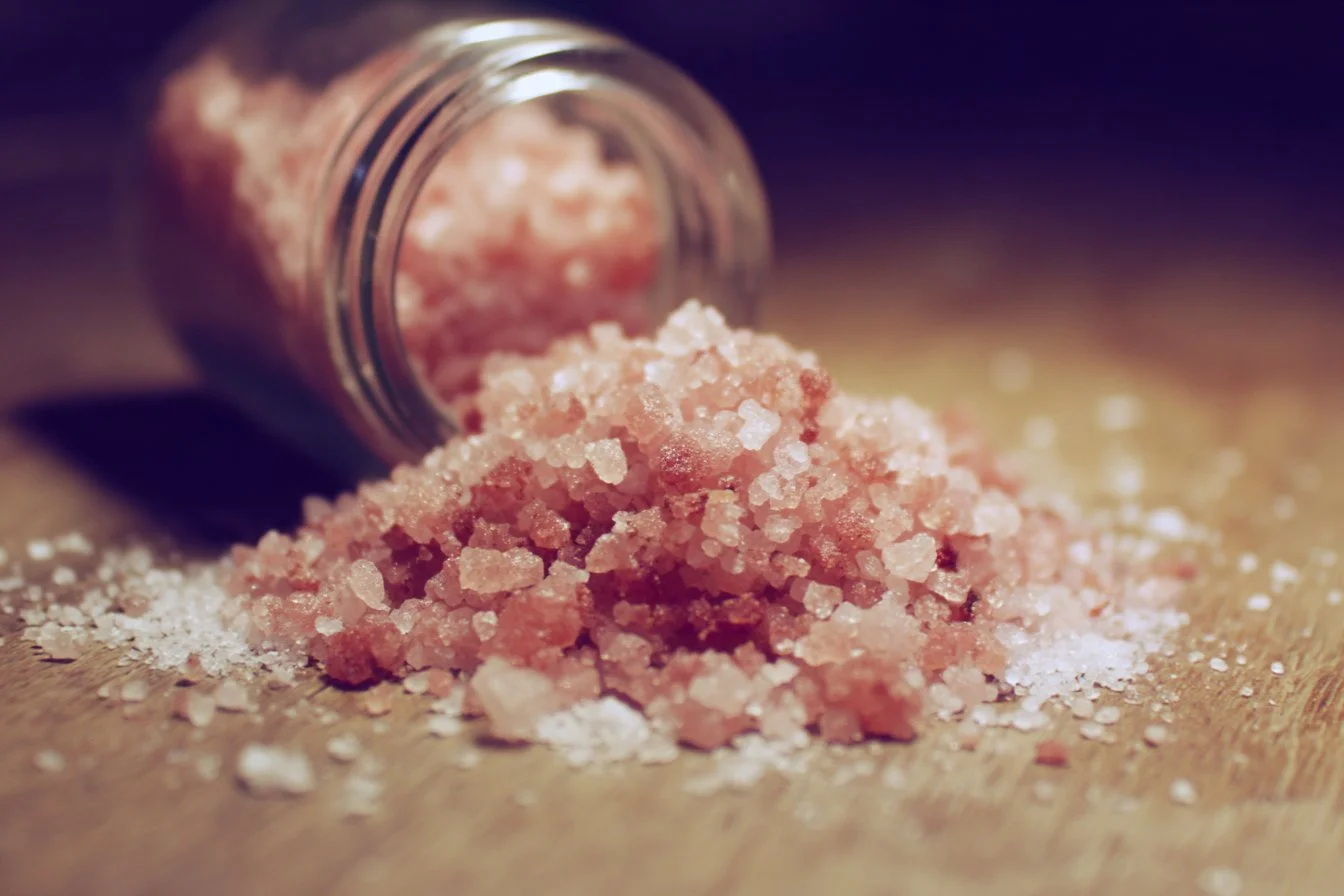 Delicious pink salt in a bowl promoting healthy cooking tips.