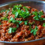 A plate of quick and delicious SOS recipe served with a side of vegetables