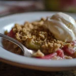 Delicious rhubarb crisp dessert served in a bowl.