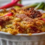 Delicious rhubarb dump cake served warm with whipped cream