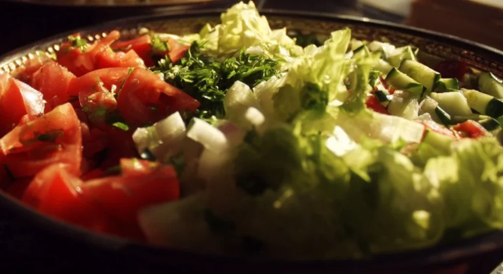 Fresh ingredients and toppings at a colorful salad bar