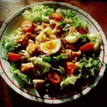 Colorful salad bowl filled with fresh vegetables and greens