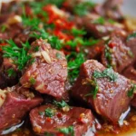 Delicious shaved beef recipe ready to be served in a dish.