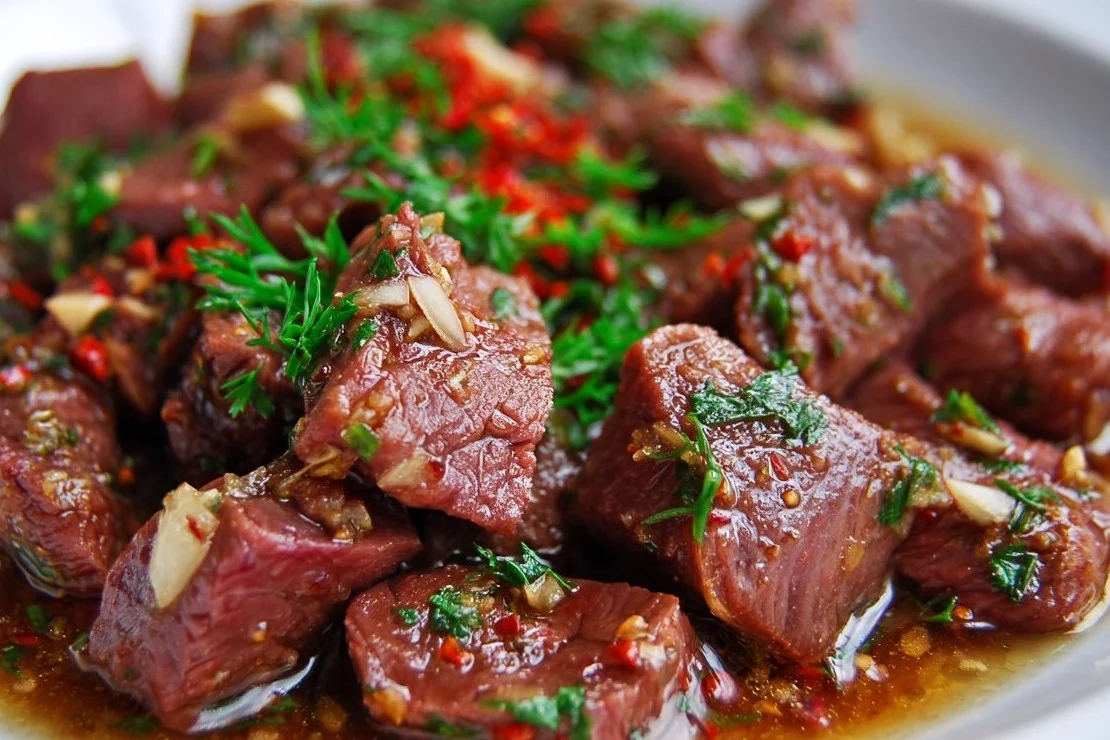 Delicious shaved beef recipe ready to be served in a dish.