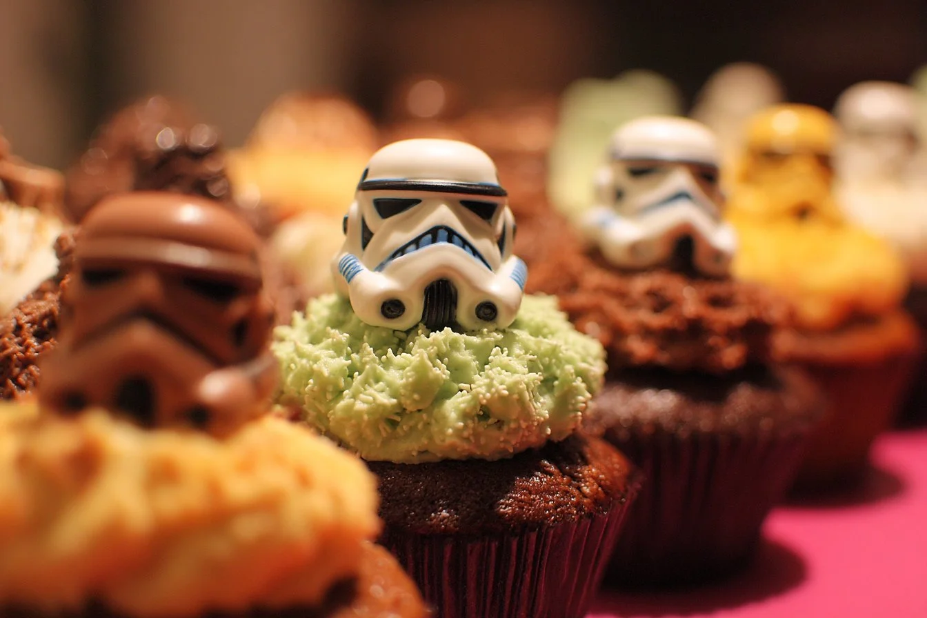Star Wars themed cupcakes featuring iconic characters and symbols.