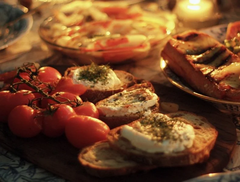 Colorful summer dinner spread featuring fresh vegetables and grilled meats
