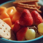 Colorful and healthy summer snacks for kids on a picnic table