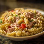 Fresh Tuna Pasta Salad with vegetables and dressing, served in a bowl.