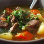 Delicious bowl of Veggie Beef Soup with fresh vegetables and tender beef chunks