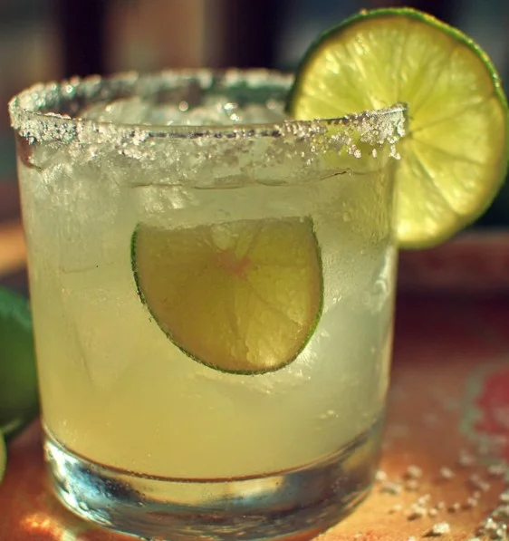 Refreshing Virgin Margarita served in a glass with lime and salt rim.