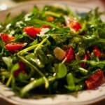 Fresh arugula salad with cherry tomatoes and a balsamic vinaigrette