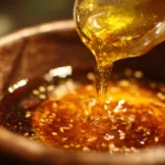 Homemade Asian salad dressing drizzled over a fresh salad