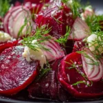 Colorful beet salad with fresh greens and toppings