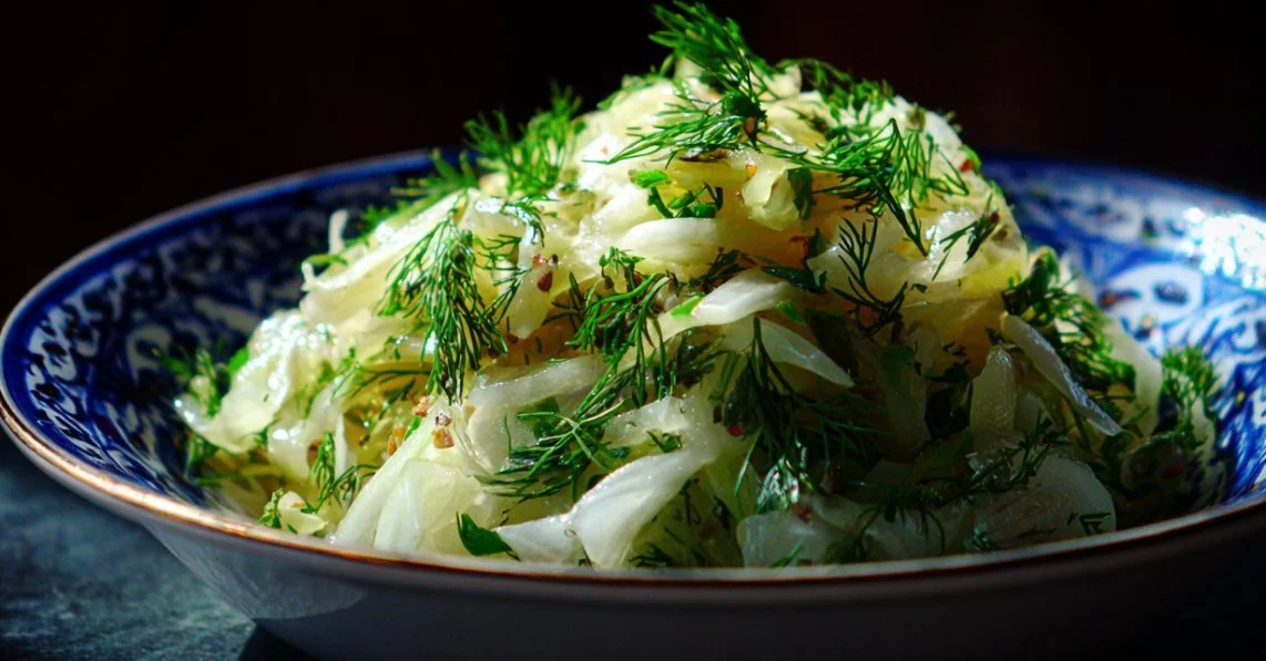Delicious fennel salad with fresh herbs and vegetables