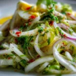 Delicious Frog Eye Salad served in a bowl with fruit and pasta