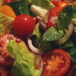 Colorful garden salad with fresh vegetables and dressing
