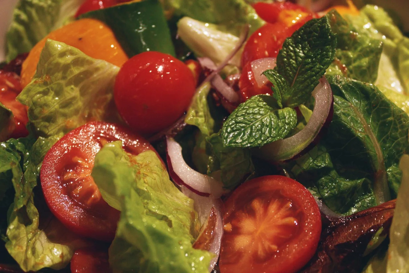 Colorful garden salad with fresh vegetables and dressing