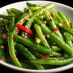 Delicious green bean salad with fresh vegetables and dressing
