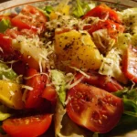 A vibrant Italian Chopped Salad with fresh vegetables and dressing