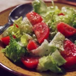 A vibrant Italian salad with fresh vegetables and dressing