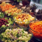 Colorful salad bar setup with fresh ingredients and toppings