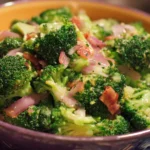 Delicious and healthy broccoli salad served in a bowl with vegetables.